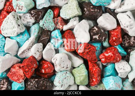 Dragee candies in the form of multi-colored pebbles as a background Stock Photo