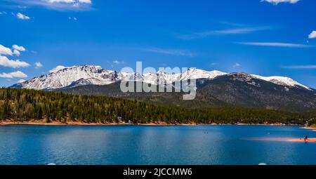 Pikes Peak panorama. Snow-capped and forested mountains near a mountain lake, Pikes Peak Mountains in Colorado Spring, Colorado, USA Stock Photo