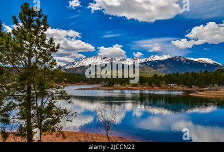 Pikes Peak panorama. Snow-capped and forested mountains near a mountain lake, Pikes Peak Mountains in Colorado Spring, Colorado, USA Stock Photo