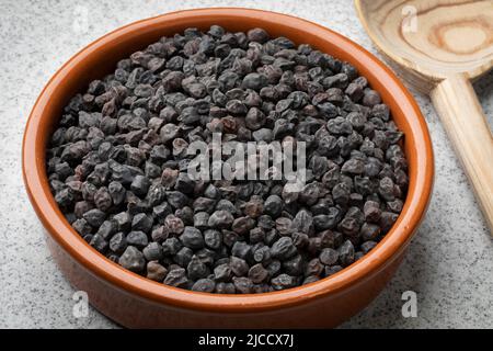 Bowl with black chickpea Murgia, ceci nero, also known by the name of cece del solco dritto in Italy Stock Photo