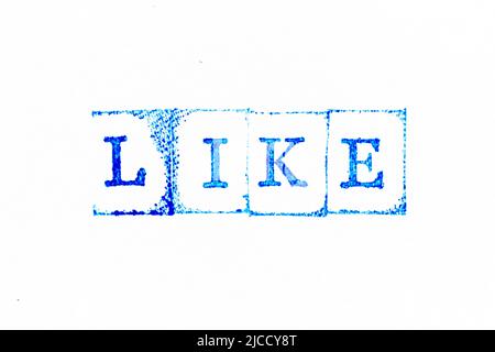 Blue color ink rubber stamp in word like on white paper background Stock Photo