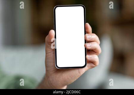 Male Hand Holding Modern Smartphone With Big Blank White Screen Stock Photo