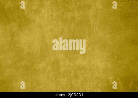 Golden colored venetian stucco wall grunge background Stock Photo