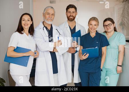 Portrait of a group of happy and successful doctors and nurses in hospital Stock Photo