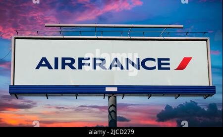 POZNAN, POL - MAY 1, 2022: Advertisement billboard displaying logo of Air France, the French flag carrier, headquartered in Tremblay-en-France Stock Photo