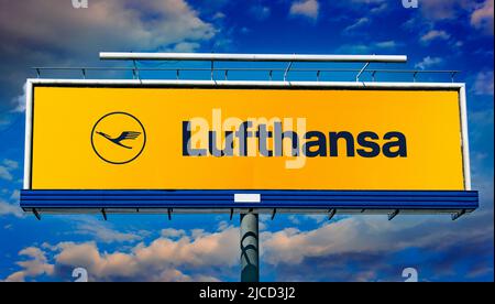 POZNAN, POL - MAY 1, 2022: Advertisement billboard displaying logo of Lufthansa, the flag carrier and largest German airline headquartered in Cologne Stock Photo