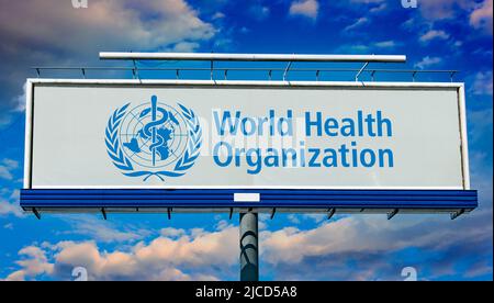 POZNAN, POL - MAY 1, 2022: Advertisement billboard displaying logo of The World Health Organization (WHO), a specialized agency of the United Nations Stock Photo