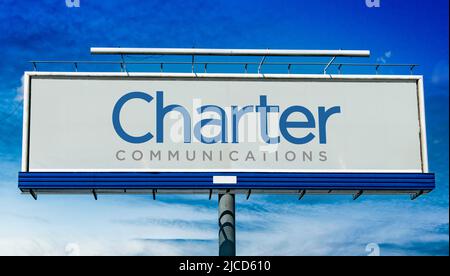 POZNAN, POL - MAY 1, 2022: Advertisement billboard displaying logo of Charter Communications, an American telecommunications and mass media company wi Stock Photo