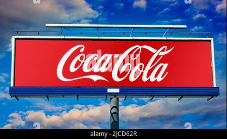 POZNAN, POL - MAY 1, 2022: Advertisement billboard displaying logo of Coca Cola Stock Photo