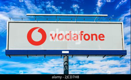 POZNAN, POL - MAY 1, 2022: Advertisement billboard displaying logo of Vodafone Group,  a British multinational telecommunications company Stock Photo