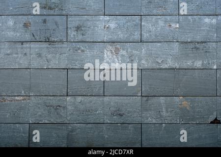 Slate effect porceliain tiles wall cladding, architecture detail background Stock Photo