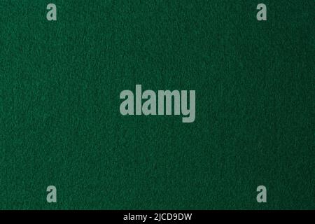 Green color felt textile fabric material texture background. Abstract monochrome dark blue color felt background Stock Photo