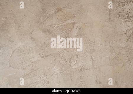 Beige colored venetian finish plaster wall grungy texture Stock Photo