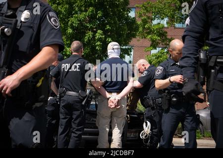 June 11, 2022, Coeur d' Alene, Idaho, USA: Police search members of the white nationalist group Patriot Front who were arrested outside of Mceuen Park. Police in Coeur d'Alene arrested “a little army” Saturday of 31 masked members of the white nationalist group Patriot Front, who reportedly 'came to riot downtown,” according to the Coeur d'Alene Police Chief. (Credit Image: © Jacob Lee Green/ZUMA Press Wire Service) Stock Photo