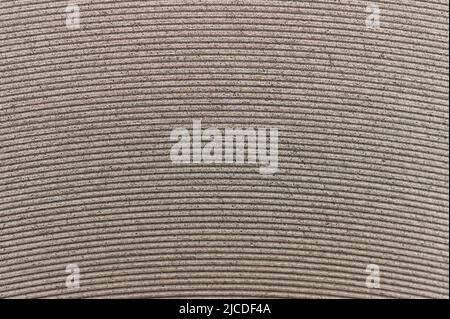 Round metal lines on grainy surface macro close up view Stock Photo