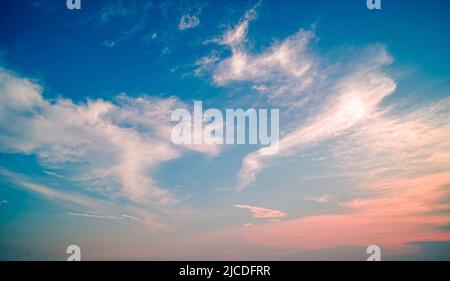 Cirrus Clouds twilight sky in pastel color Pink and blue, colorful spiritual background. Stock Photo