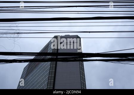 Electric wiring in front of the Sino Thai Tower in Bangkok Stock Photo
