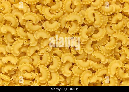 Background of dried macaroni cockerel scallops close up Stock Photo