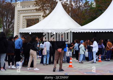 People waiting in queue outdoor in a sunny day to take autograph of  celebrity Stock Photo