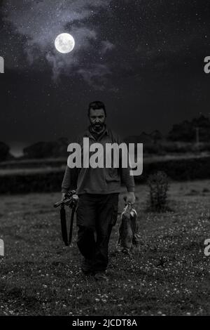A man shooting a rabbit Stock Photo - Alamy