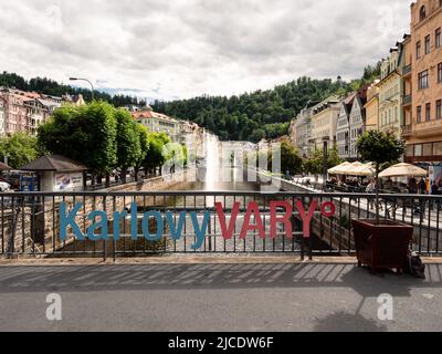 Karlovy Vary, Bohemia, Czech Republic - May 26 2022: Carlsbad Cityscape with Logo or Sign of the Town and River Tepla. Stock Photo