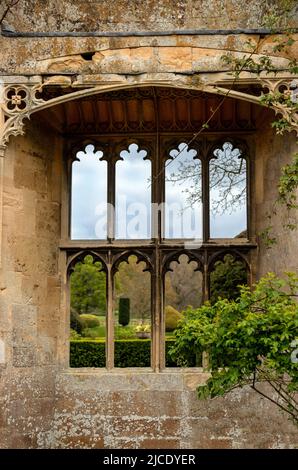 Richard III Banqueting Hall, a 15th century ruin with view of the Sudeley Castle Garden through the lancet windows, Gloucestershire, England, UK. Stock Photo