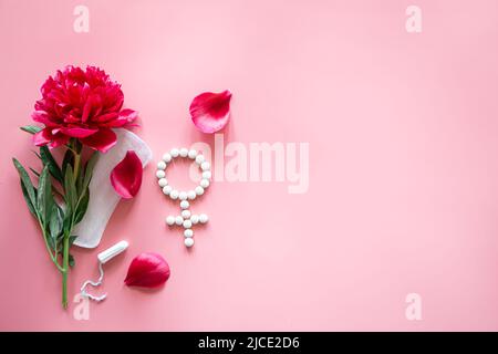 Flat lay composition with feminine hygiene products and flower. Stock Photo