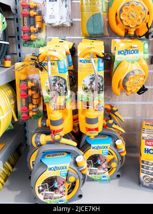 Display of Hozelok proprietary hose fittings on display in a garden centre Stock Photo