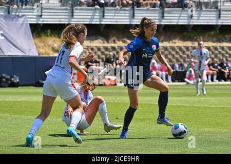 San Diego, California, USA. 12th June, 2022. OL Reign defender Sofia Huerta (11) and San Diego Wave FC forward Alex Morgan (13) battle for the ball during a NWSL soccer match between the OL Reign and the San Diego Wave FC at Torero Stadium in San Diego, California. Justin Fine/CSM/Alamy Live News Stock Photo