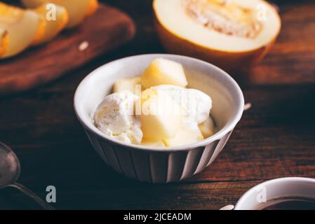 Vanilla Ice Cream with Slices of Honeydew Melon in Bowl Stock Photo