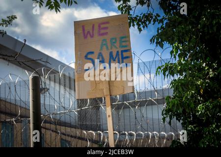 Placard against the UK deportation flights to Rwanda near Brook House Immigration Removal Centre on June 12, 2022 in London, England. Stock Photo