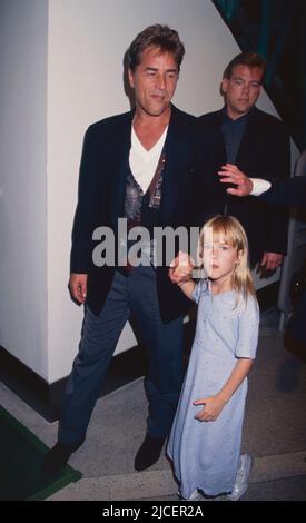 Don Johnson and daughter Dakota Johnson attend the premiere of 'Tin Cup' at the Museum of Modern Art in New York City on August 6, 1996.  Photo Credit: Henry McGee/MediaPunch Stock Photo