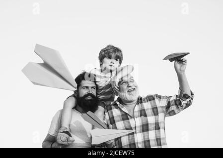 Generation of people and stages of growing up. Excited teach. Enjoy family together. Grandfather with son and grandson having fun in park. Happy man Stock Photo