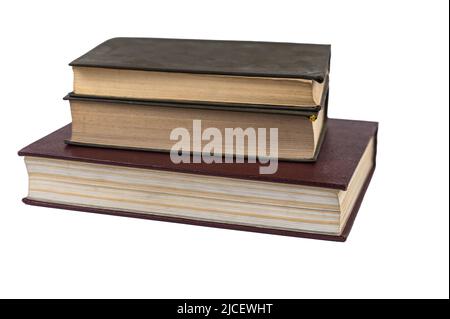 A stack of books isolated against a white background. Large red book and two green ones. Closed books with yellowed pages. Hardcover. Literature, read Stock Photo