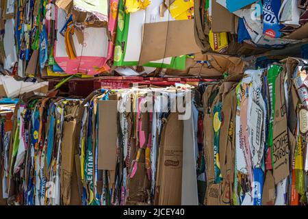 Compressed cardboard ready for recycling pick-up at Sam's Club warehouse store in Gwinnett County, Georgia. (USA) Stock Photo