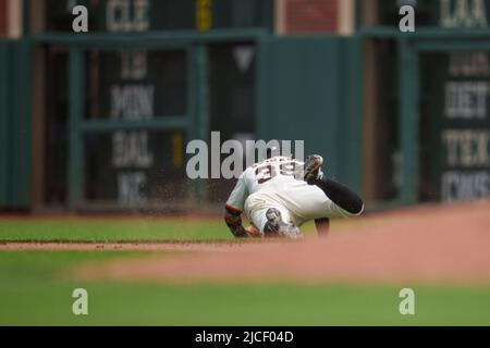 s38 fields a ground ball hit by Los Angeles Dodgers second baseman Hanser Alberto (not pictured) during the fifth inning in San Francisco, Sunday Ju Stock Photo