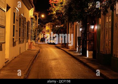 Iluminated empty street at night with colonial buildings in Cartagena, Unesco World Heritage Stock Photo