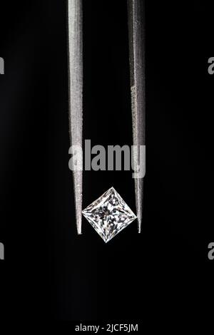 Tweezers with beautiful shiny diamond isolated on white Stock Photo - Alamy