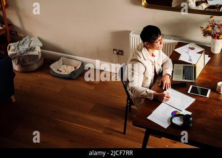 Asian male focused on work Stock Photo