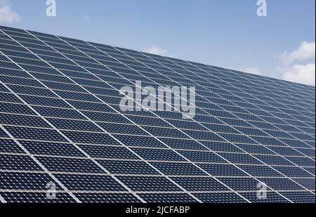 Solar panels against blue sky Stock Photo