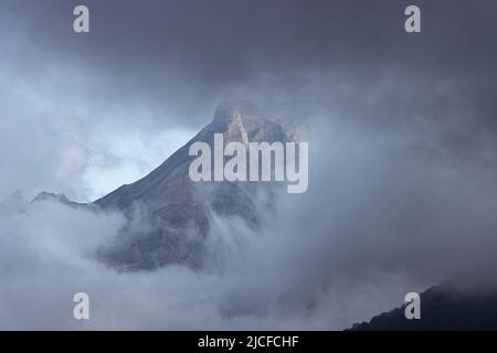 Mountain top shrouded in fog and clouds in the French Pyrenees Stock ...