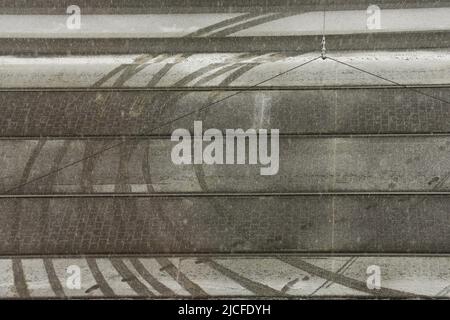Car tracks on tram rails in the snow Stock Photo