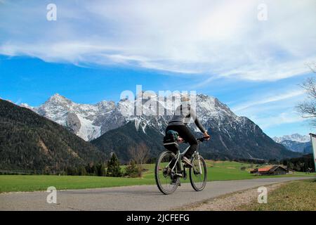 Bicycle tour with the mountain bike in the humpback meadows near Mittenwald, Germany, Bavaria, Upper Bavaria, Isar valley, road, path, bike, Karwendel mountains, Stock Photo