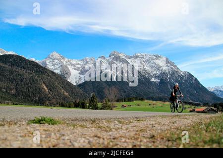 Bicycle tour with the mountain bike in the humpback meadows near Mittenwald, Germany, Bavaria, Upper Bavaria, Isar valley, road, path, bike, Karwendel mountains, Stock Photo