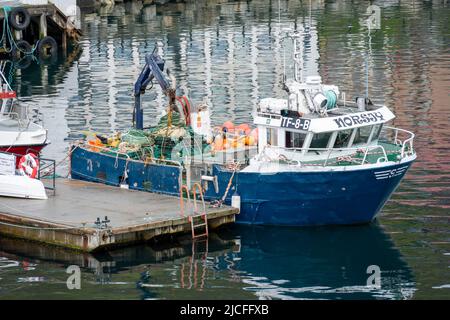 Norway, Troms og Finnmark, fishing boat in Honningsvag harbor. Stock Photo