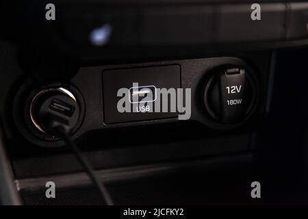 USB and aux ports for connecting multimedia players in luxury car. Stock Photo
