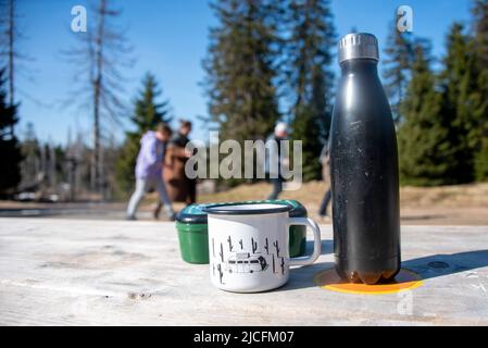 Thermos, drinking cup, butter dish, hiker, ascent to Brocken, Torfhaus, Lower Saxony, Harz Mountains Stock Photo