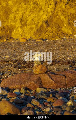 Pile of pebbles on the beach, stienmännchen Stock Photo