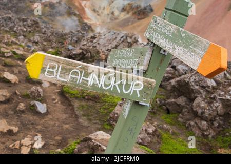 Laugavegur hiking trail is the most famous multi-day trekking tour in Iceland. Landscape photo from the area around Landmannalaugar, starting point of the long-distance hiking trail in the highlands of Iceland. Signpost Bláhnúkur. Stock Photo