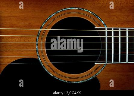 Closeup view of mahogany acoustic guitar inlay and soundhole Stock Photo